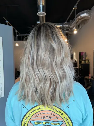 Bright blonde shoulder-length waves by Tian, Lacey WA hair colorist